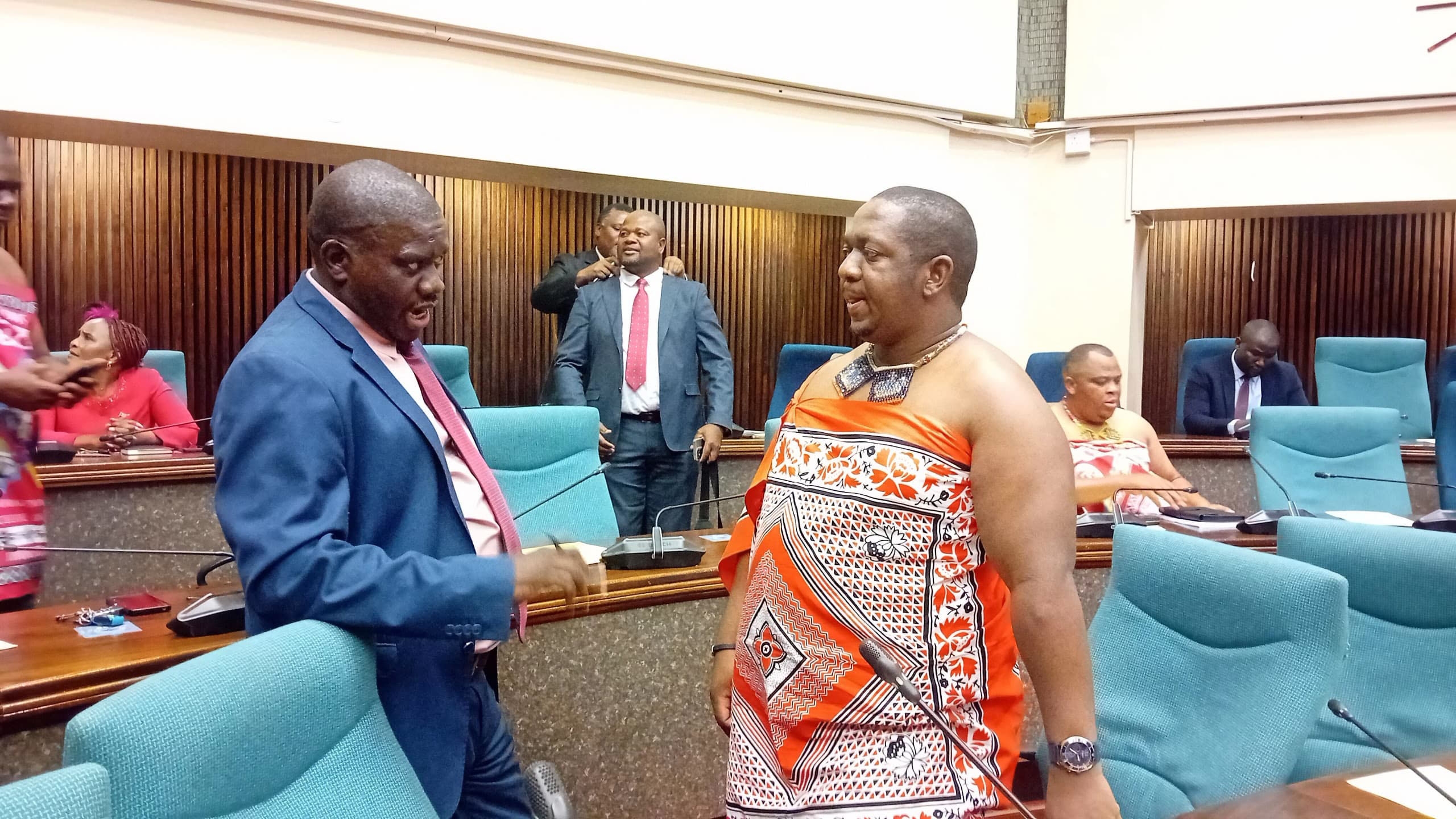 Minister for Labour and Social Security Phila Buthelezi (R) in a conversation with Gege MP Magesi Dlamini.