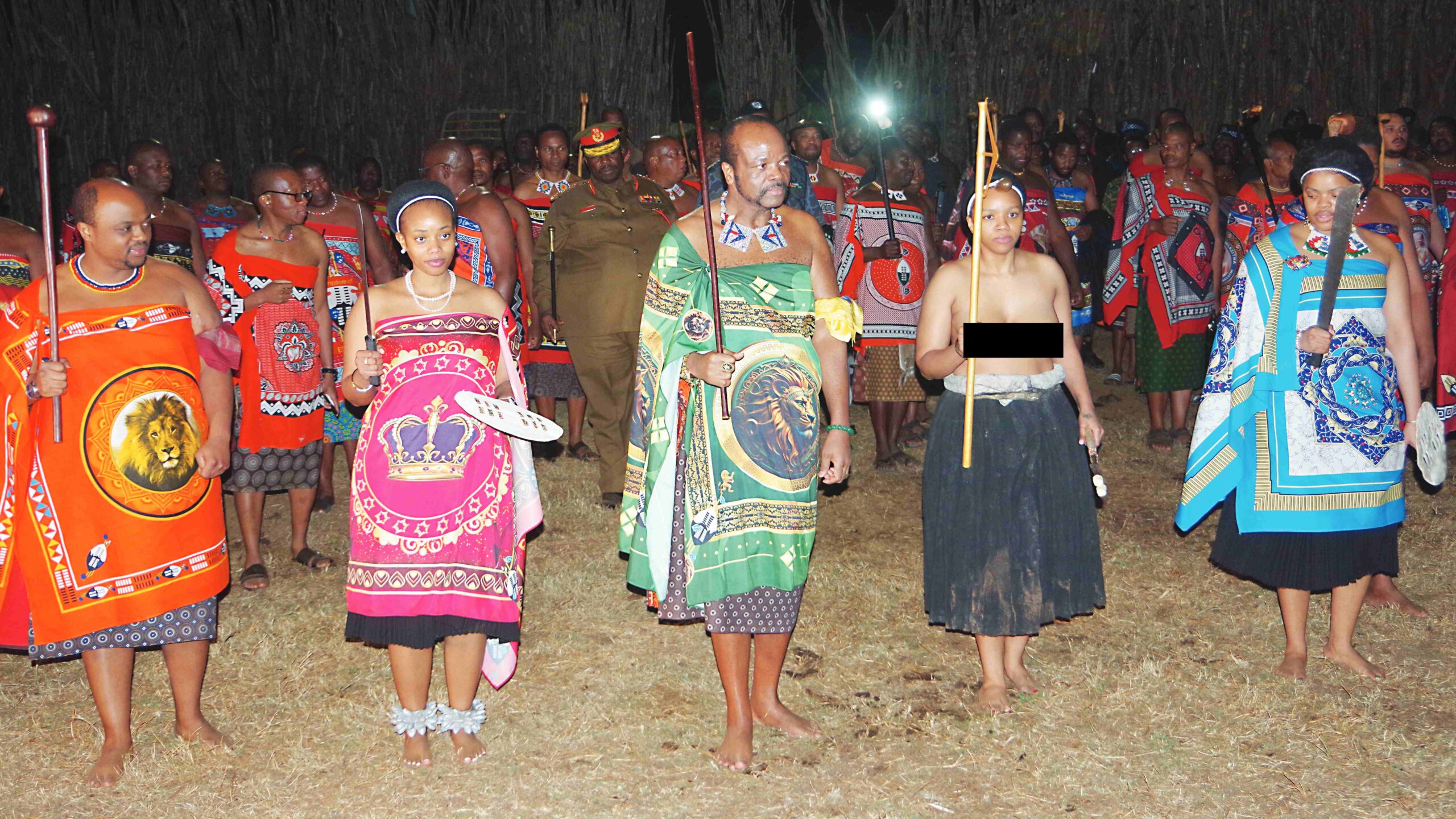 His Majesty King Mswati III dancing with Princess Sibahle (2nd R), Princess Sikhanyiso (R), Prince Bandzile (L) and Princess Temtsimba before the commissioning of the umtsimba.