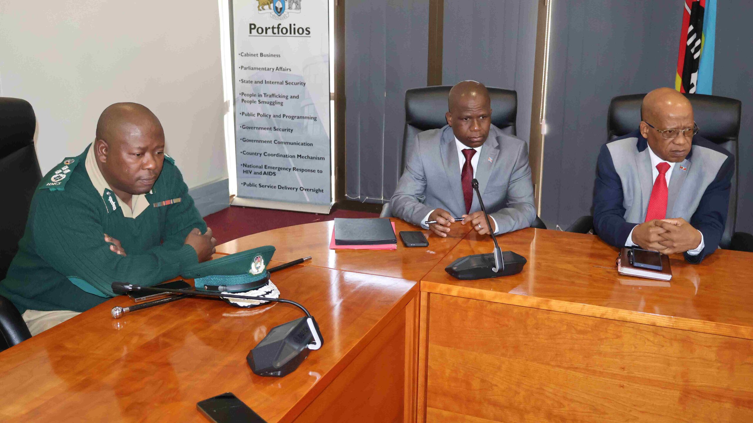 HMCS Senior Officer Vusi Kunene, Principal Secretary in the Ministry of Public Service Mthunzi Shabangu and Secretary to Cabinet Victor Shabangu following proceedings during the announcement of the Phase II adjustments.