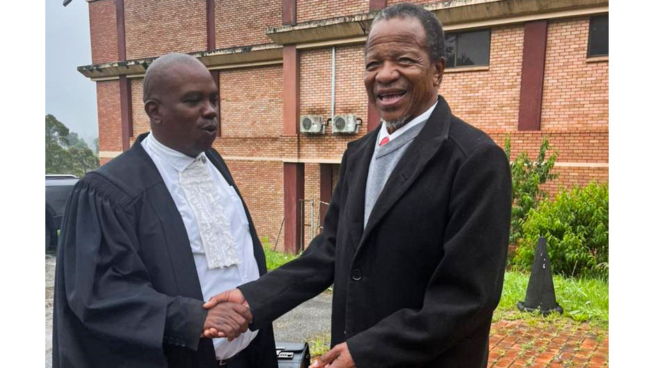 Mbabane Swallows FC legal representative Thabiso Fakudze shakes hands with club president Absalom Ngwenya outside court after securing the club’s legal victory. (Pic: Sanele Jele)