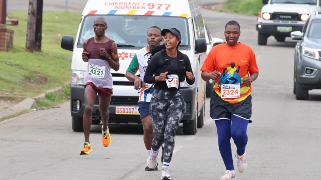 Usutu 21km runner Bongani Emmanuel Motsa (R) giving his all on the road last Saturday.