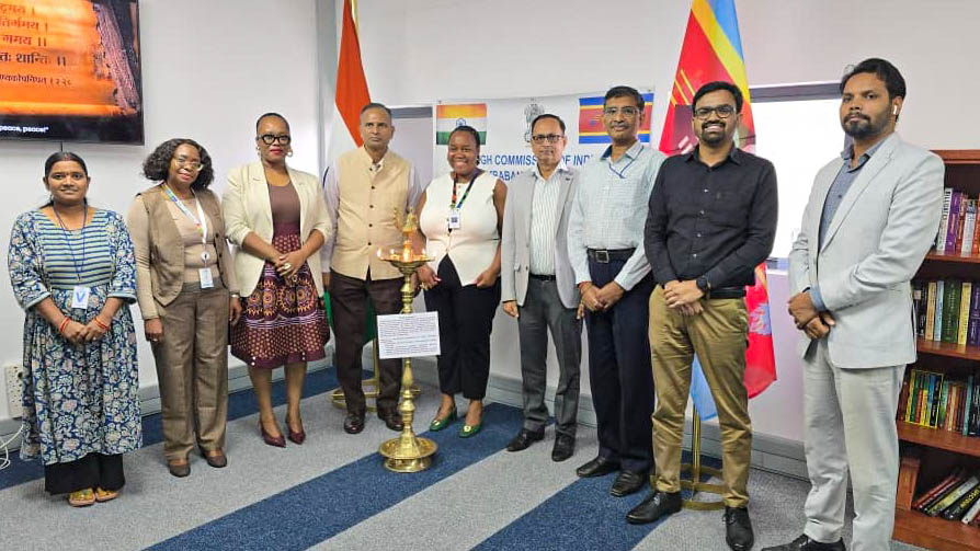 Mandisa Zwane, National Project Officer at UNESCO, lighting a candle while Indian High Commissioner H.E.  Ram Prasad looks on. (Courtesy pics)