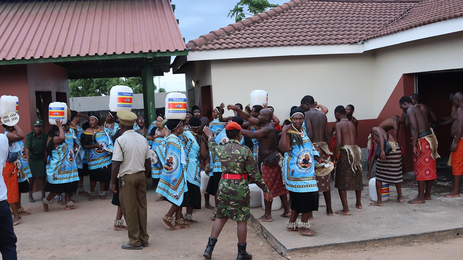 Some emajaha assisting lutsango in delivering the buganu brew.