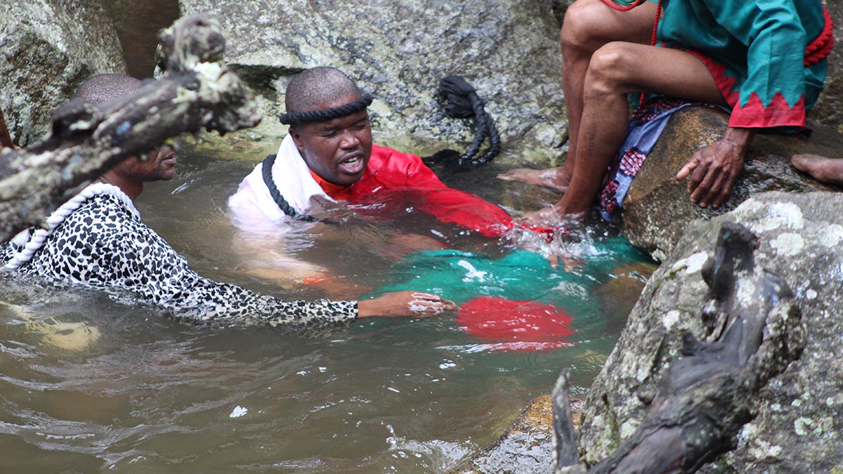 One member fully immersed himself in the sacred waters, while Bishop Mkhatjwa and other pastors prayed over him. (Pics: Siphosethu Dlamini)