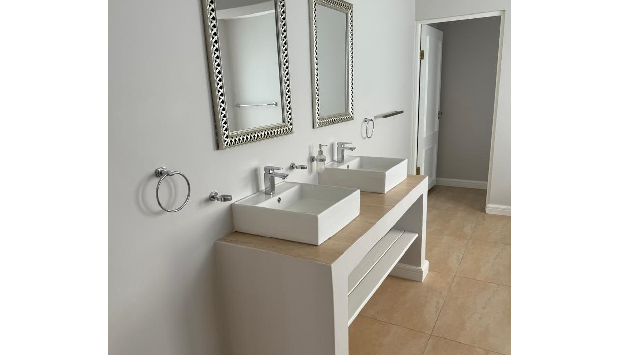 The master bathroom also offers a double sink. One of the en suite bathrooms fitted with a bathtub and a shower.