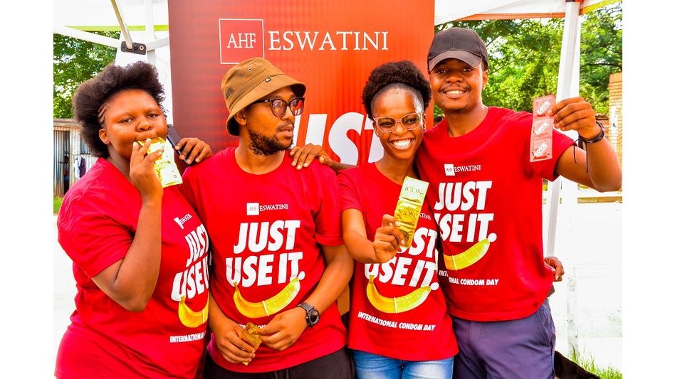 Youth-led advocacy in action u2013 Volunteers from AHF Eswatini proudly display condoms during the International Condom Day celebrations, reinforcing the message: u2018Just Use Itu2019 to prevent HIV and STIs.