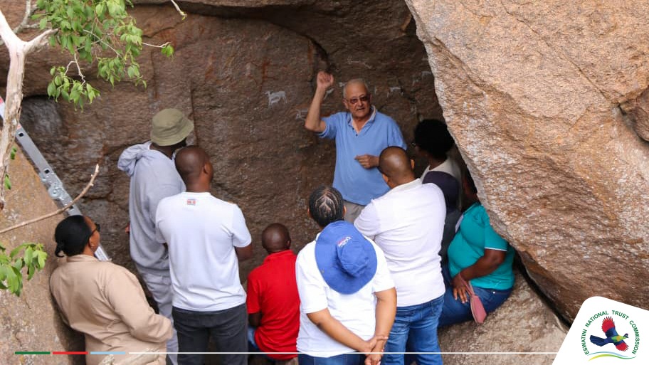 An expert explaining about the rock paintings during the tour of the cave.
