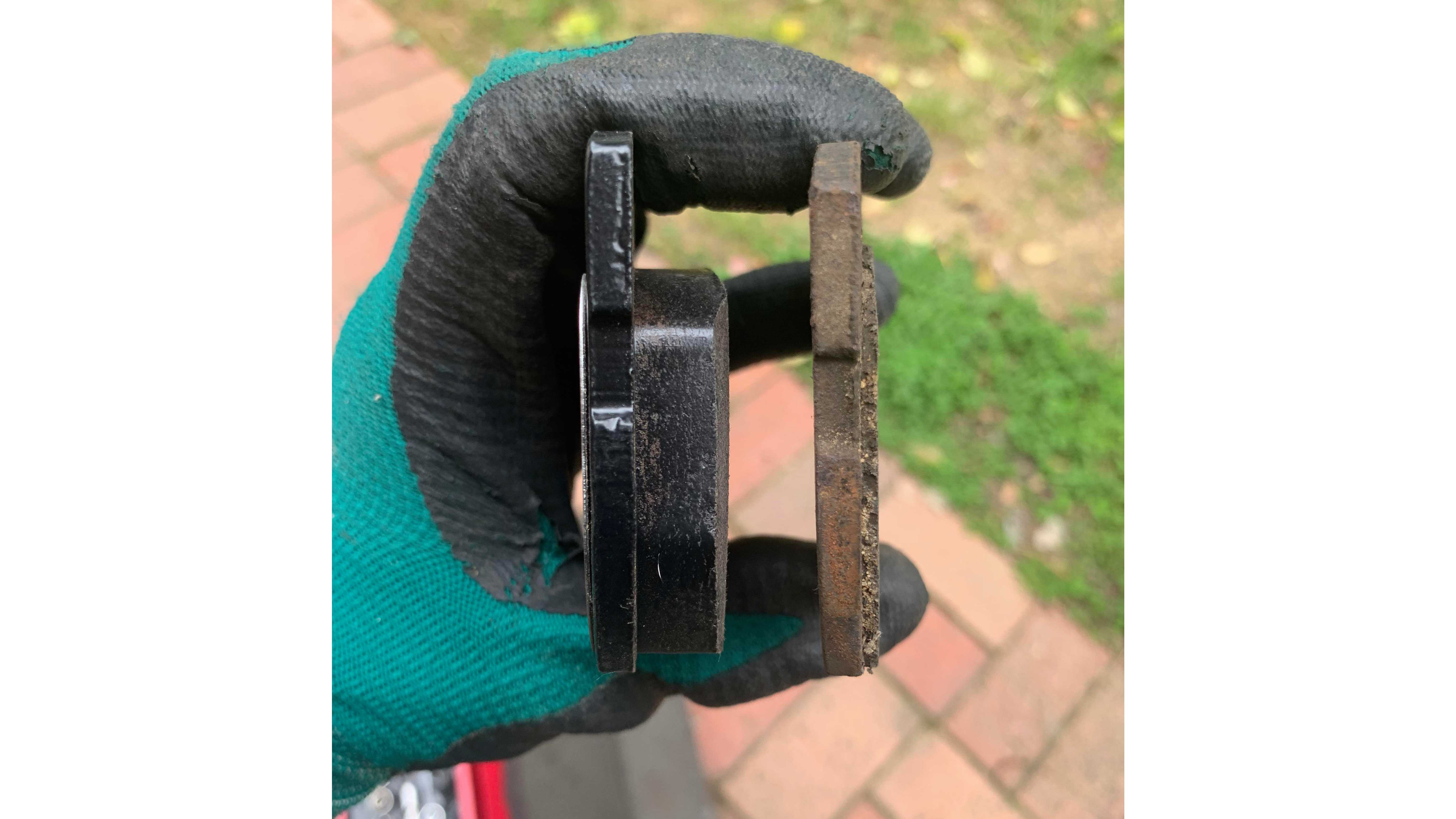 Different levels of wear between new (L) vs old (R) brake pads.