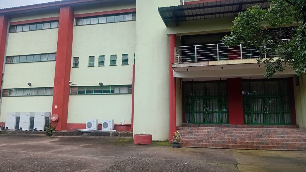 The backview of the building which also shows the ample parking space.
