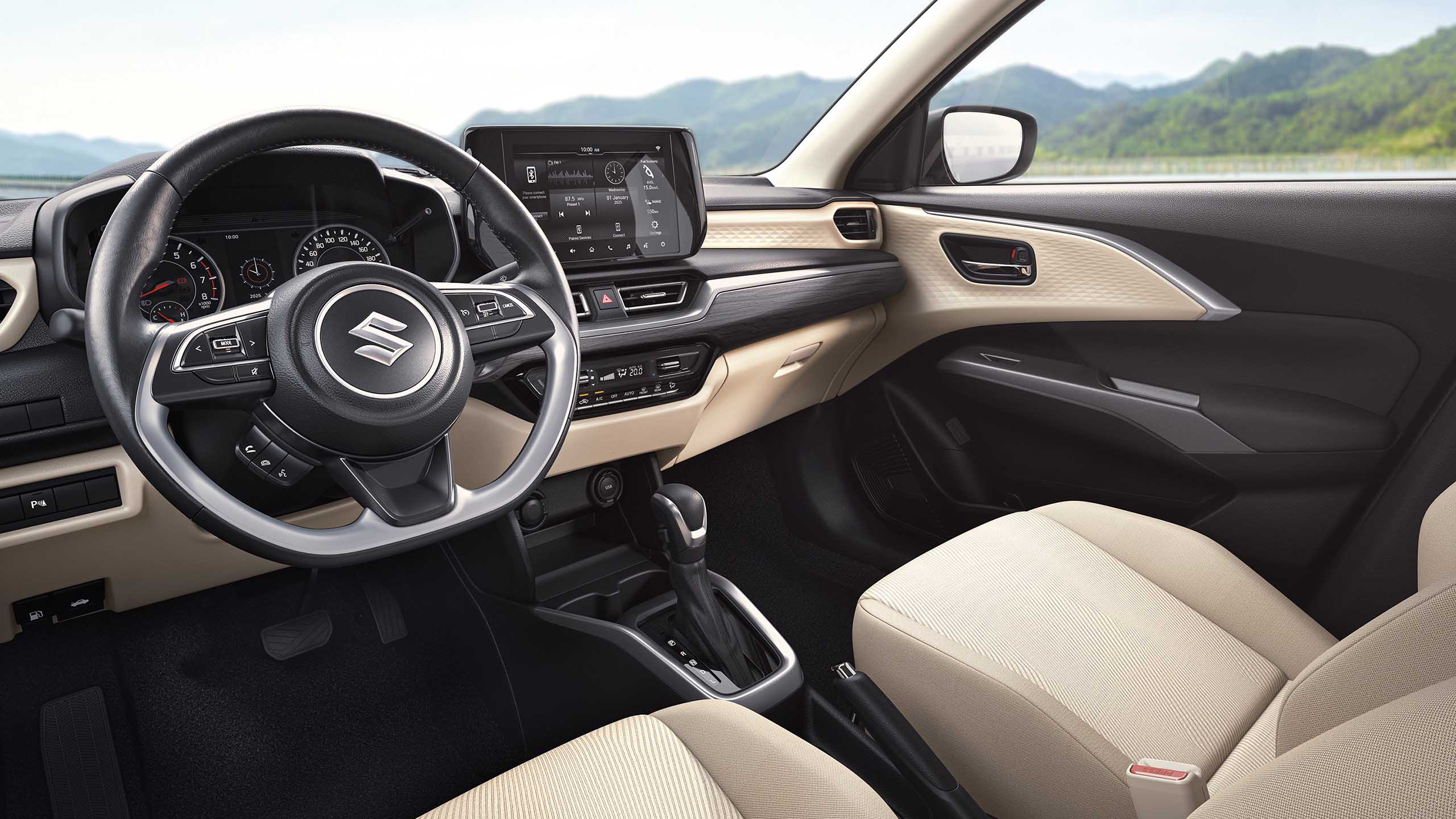 The dual-tone black and beige interior of the 2025 Dzire creates a modern, airy feel, while premium details like chrome accents (GL+ models) add a refined touch.