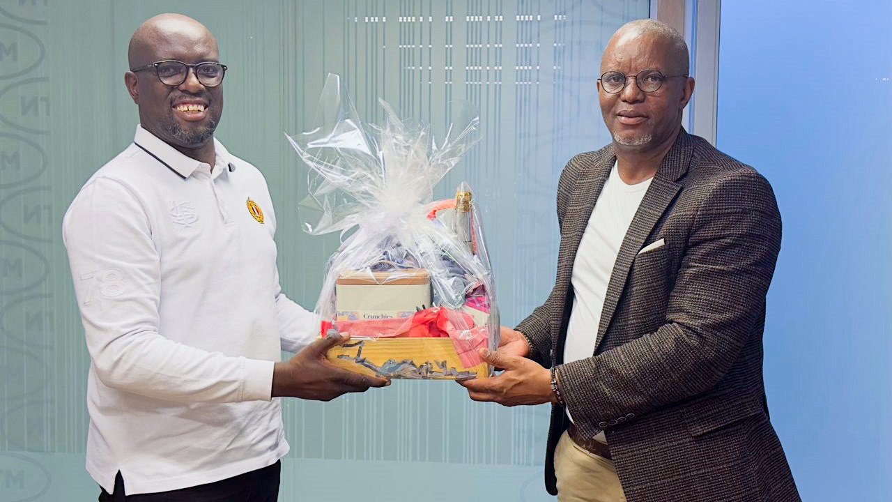PLE Chairman Polycarp Dlamini (R) handing a gift to former MTN Eswatini CEO Wandile Mtshali during the pre-match briefings for the double-header, held at Sigwaca House. (Courtesy pic)
