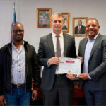 Minister for Finance Neal Rijkenberg (C) receiving a share certficate from SBS Bank Eswatini’s General Manager Leonard Dlamini (R) and Manager Legal and Board Secretary Velaphi Dlamini. (Courtesy pic)