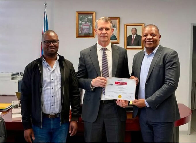 Minister for Finance Neal Rijkenberg (C) receiving a share certficate from SBS Bank Eswatini’s General Manager Leonard Dlamini (R) and Manager Legal and Board Secretary Velaphi Dlamini. (Courtesy pic)