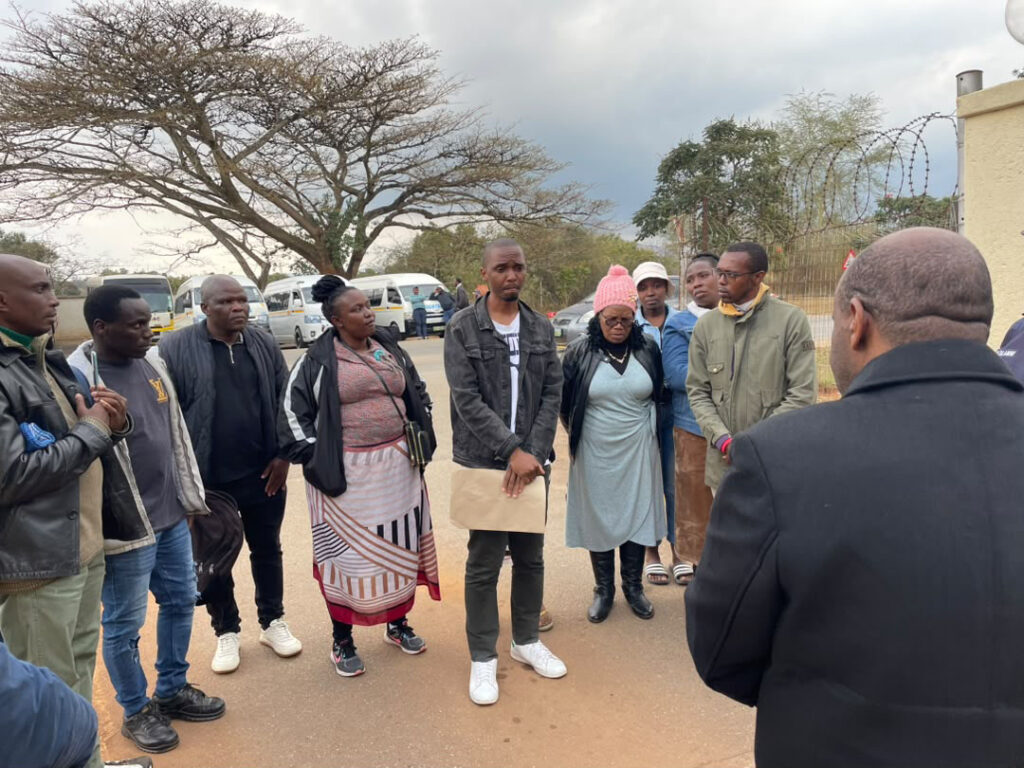 A member of the parliamentary staff listening to some of the employees outlining the contents of the petition yesterday. (Pic: Mlondzi Nkambule)