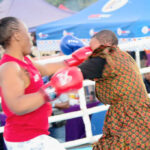 Popular content creator Bongiwe Dlamini concedes a heavy fist to the face from three-time champion of the Embiveni Biggest Braai Women Exhibition bouts, Thulile Dlamini, during their fight. (Pics: Nimrod Hlophe)