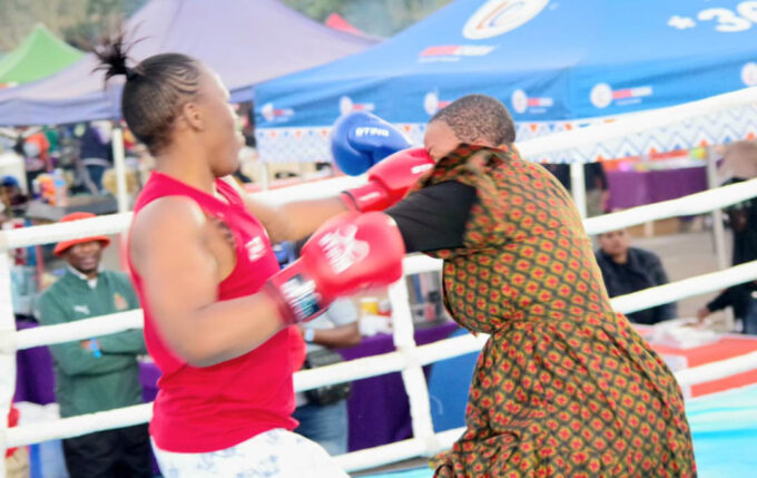 Popular content creator Bongiwe Dlamini concedes a heavy fist to the face from three-time champion of the Embiveni Biggest Braai Women Exhibition bouts, Thulile Dlamini, during their fight. (Pics: Nimrod Hlophe)