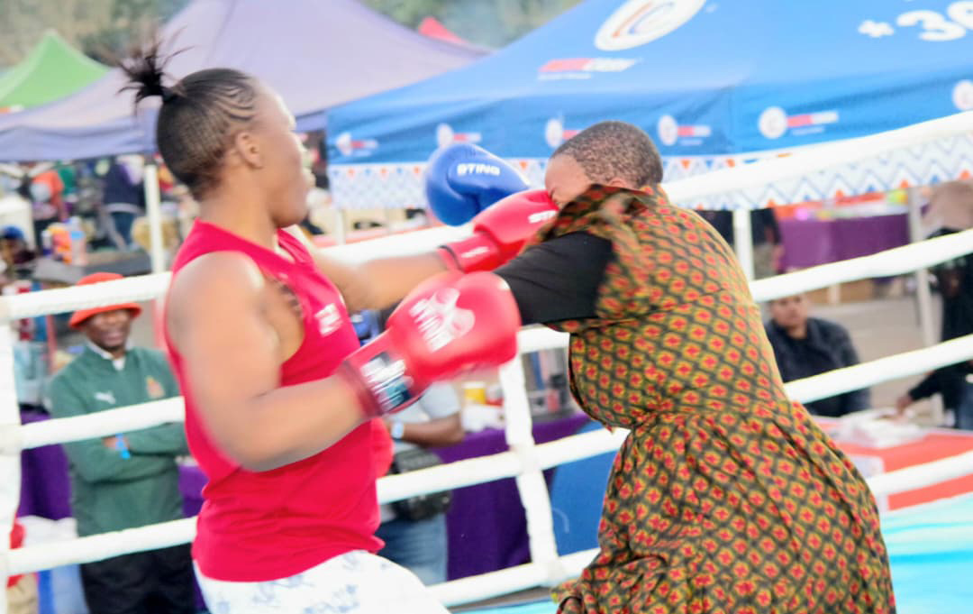 Popular content creator Bongiwe Dlamini concedes a heavy fist to the face from three-time champion of the Embiveni Biggest Braai Women Exhibition bouts, Thulile Dlamini, during their fight. (Pics: Nimrod Hlophe)