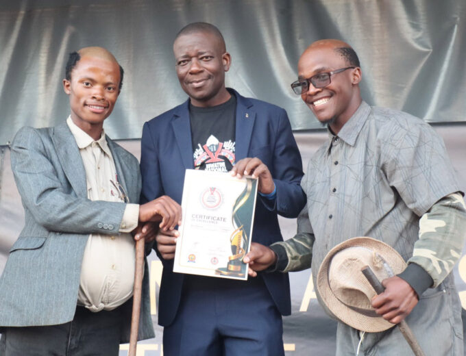 The Minister for Sport, Culture and Youth Affairs Bongani Nzima flanked by some of the winners on the day.