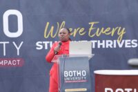 Sharon Maziya addressing students at the podium, equipping them with essential skills on building effective LinkedIn profiles and CV writing during the event.