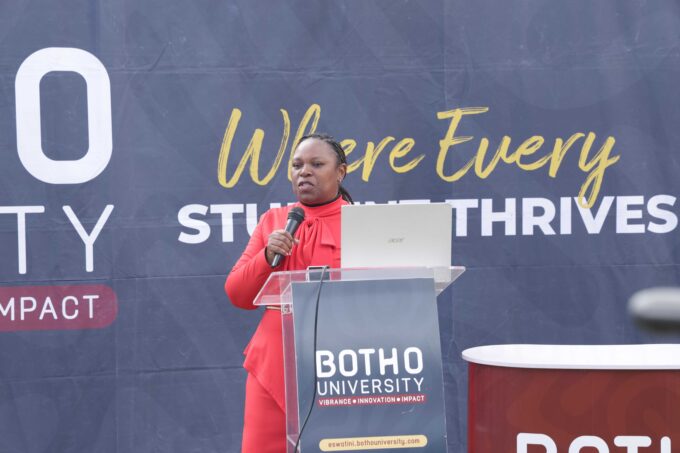 Sharon Maziya addressing students at the podium, equipping them with essential skills on building effective LinkedIn profiles and CV writing during the event.