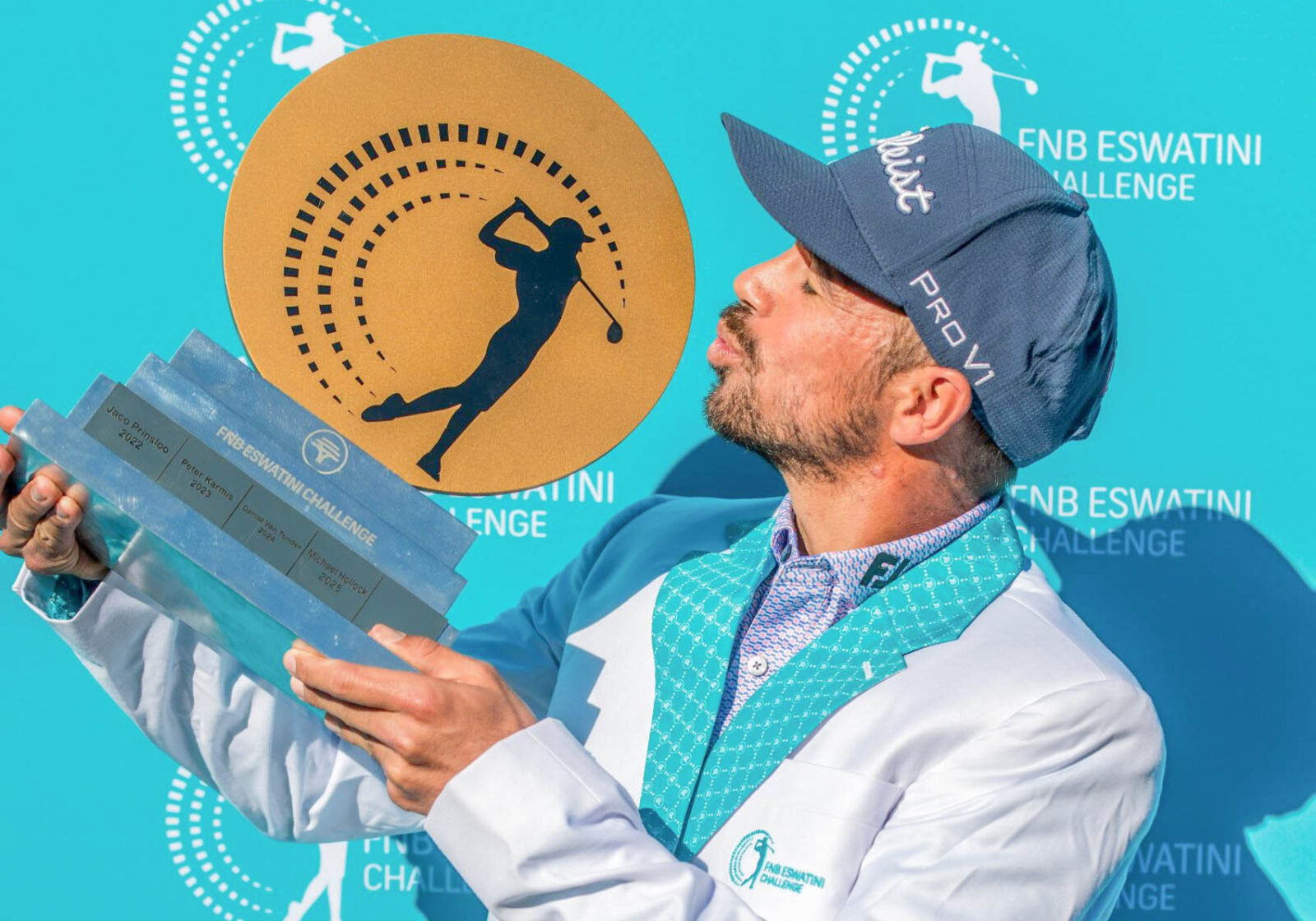 Austin Baustista admiring his FNB Eswatini Challenge trophy.