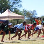 Athletes explode from the starting line during one of the sprint events at the 2026 ISASA Eswatini Primary Schools Interschools Athletics Championships.