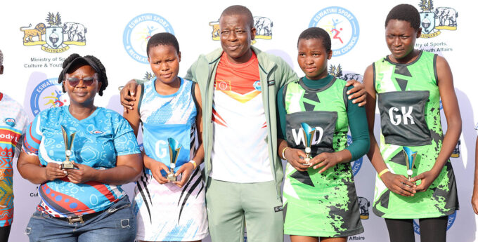 Minister for Sports, Culture and Youth Affairs Bongani Nzima flanked by standout individual performers of 2026 Tinkhundla Talent Search Netball Competition, a grassroots initiative he credited with also helping drive the ministry to top-performing status. (Pic: Nimrod Hlophe)