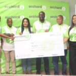 Orchard Insurance MD Joseph Museva (3rd from R) presenting the E40 000 replica cheque to Nsingizini Hotspurs Marketing Chairperson Nozipho Shabangu (3rd from L). (Pic: Machawe Fakudze)