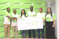 Orchard Insurance MD Joseph Museva (3rd from R) presenting the E40 000 replica cheque to Nsingizini Hotspurs Marketing Chairperson Nozipho Shabangu (3rd from L). (Pic: Machawe Fakudze)