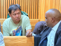 Li Peng Chi and Lawyer Sifiso Jele in discussion during his previous appearance at the High Court of Eswatini.