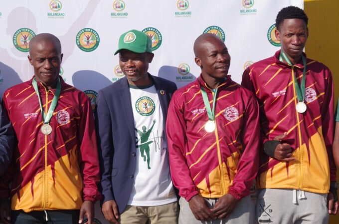 Eswatini Housing and Urban Development Minister Appolo Maphalala awarded medals to the UEDF Nhlangano Half Marathon's 5km podium male stars Wonderboy Mdluli, Nhlanhla Maphalala and Samkeliso Simelane. (Pic: Nimrod Hlophe)
