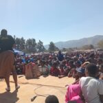 Maidens listen to teachings in form of plays and talks.