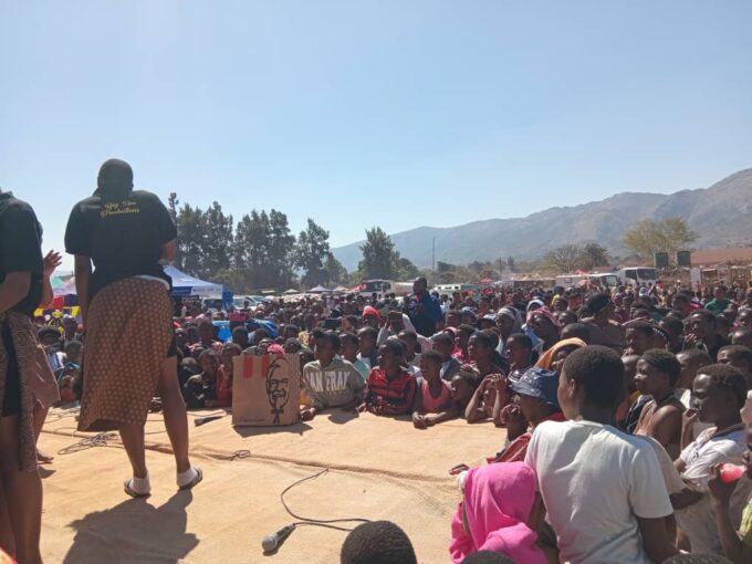 Maidens listen to teachings in form of plays and talks.