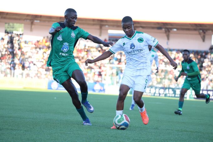 Nsingizini Hotspurs' Quality 'Mashimeni' Dlamini tries to protest his ball as Njabulo 'Magwegwe' Magagula of Green Mamba closes in.(File pic)