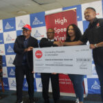Business Account Executive Nathi Dlamini handing over the cheque replica to EIPA Chief Executive Officer Sibani Mngomezulu, while Jenny's Denise Da Silva and Trade Executive Sibusiso Mnisi (far left) look on. (Pics: Timothy Simelane)