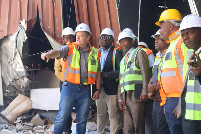J&E Contractor General Manager Carl Smith showing the Minister for Housing and Urban Development Appolo Maphalala the damage. (Pics: Timothy Simelane)