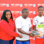 Pigg’s Peak Clean Up Campaign organising team members Busisiwe Simelane, Nomcebo Matsebula and Busta Vilakati hand over soccer boots to Player of the Series Innocent Mphahleni of KaMhlushwa Real Madrid, alongside Highlands Inn’s Olivia Hlophe, during the prize presentation.