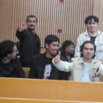 Foreign nationals celebrate after being sentenced to six months' imprisonment or a E500 fine on each of two counts for immigration and illegal employment offences.
