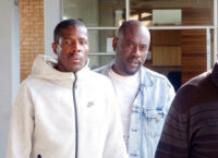 Joseph Tshimologo and Boipuso Jabulani Keagile leaving the Mbabane Magistrates Court.
