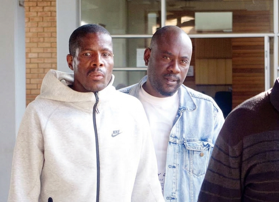 Joseph Tshimologo and Boipuso Jabulani Keagile leaving the Mbabane Magistrates Court.