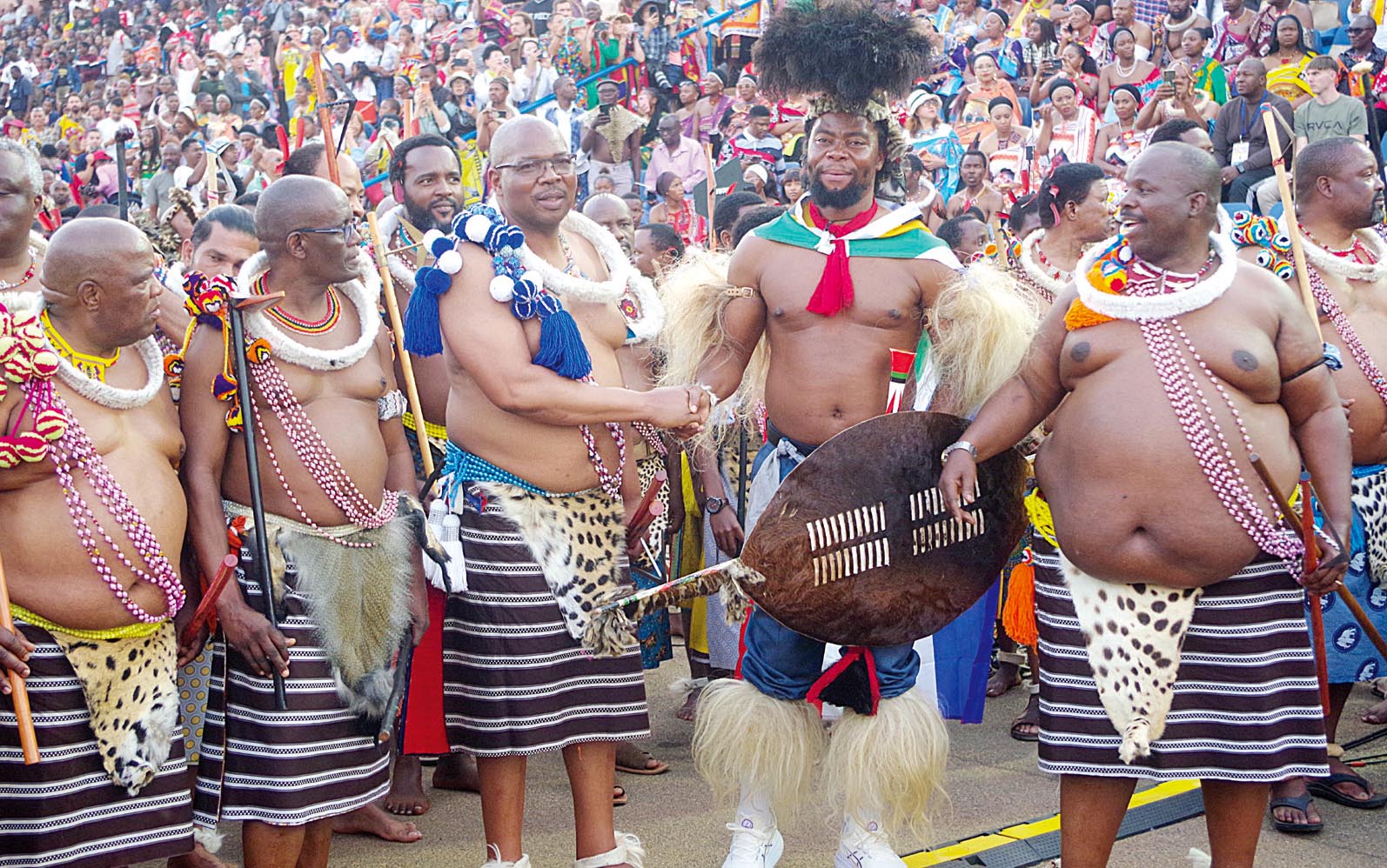 National Commissioner of Police Vusi Manoma Masango (3rd L) with Nkosikhona Ndabandaba, widely known as Phakelum’thakathi and Army Commander General Mashikilisane Fakudze (R) during the course of the main day of the first leg of this year’s annual Umhlanga Ceremony at Ludzidzini Royal Residence.