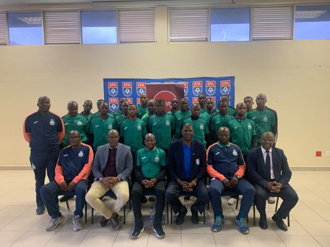 Green Mamba pose for a group picture with EFA president Peter Simelane (4th L)and PLE chairman Polycarp Dlamini (2nd L)ahead of their CAF Confederation Cup clash.(Pic:Sanele Jele)