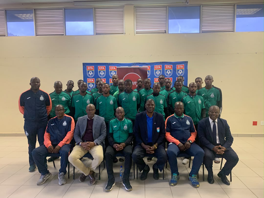 Green Mamba pose for a group picture with EFA president Peter Simelane (4th L)and PLE chairman Polycarp Dlamini (2nd L)ahead of their CAF Confederation Cup clash.(Pic:Sanele Jele)