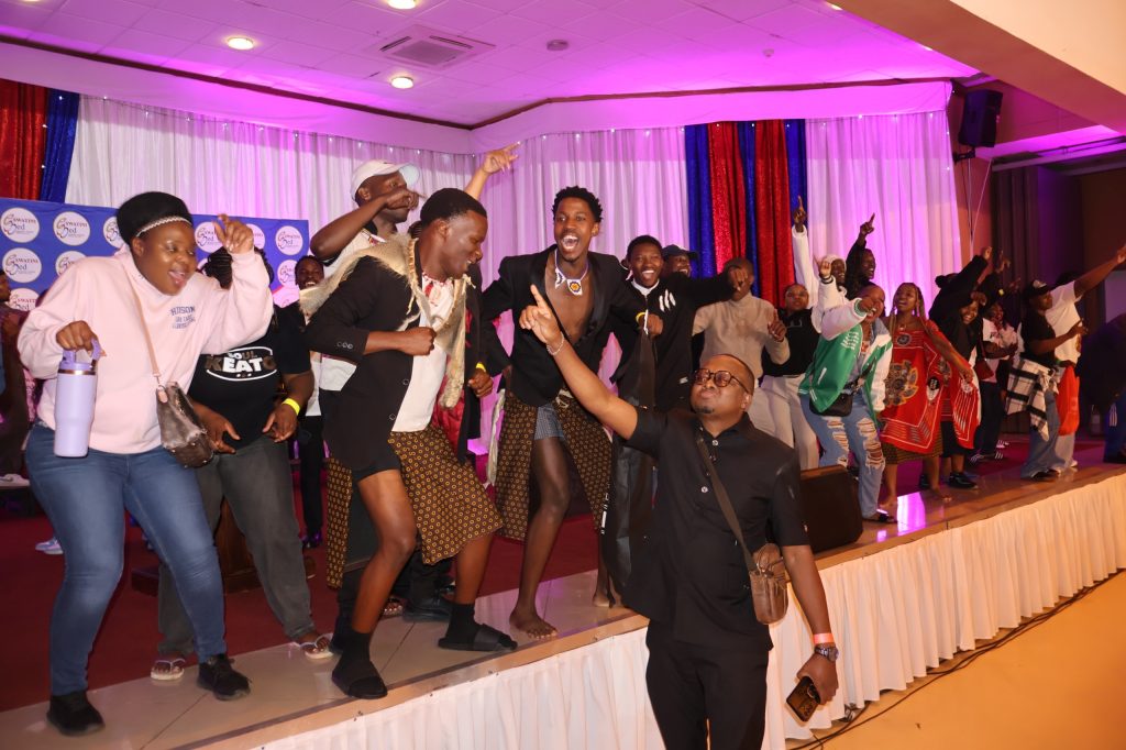 Pure Voices celebrating with Eswatini National Choral Music Association President Sihle Gumbi after being named position one in the African piece