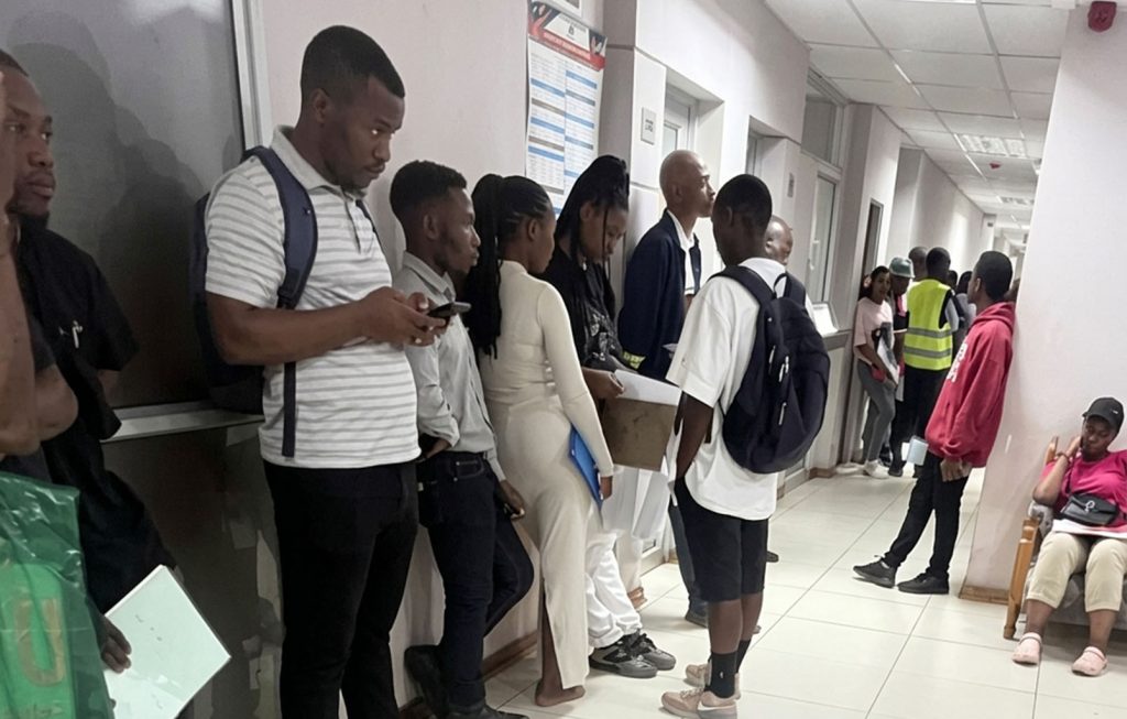Some of the emaSwati who are stranded at the Ministry of Home Affairs headquarters due to the network breakdown. (All pics Mnelisi Dlamini)