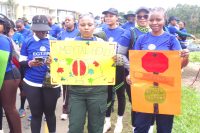 Participants display placards carrying mental health awareness messages during the walk. (Pic: Nimrod Hlophe)