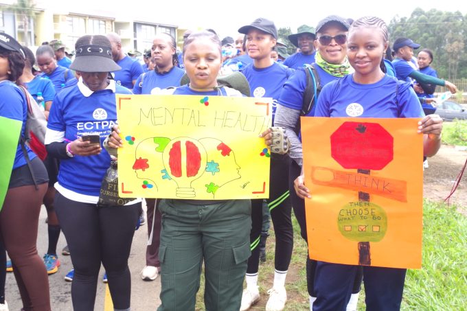 Participants display placards carrying mental health awareness messages during the walk. (Pic: Nimrod Hlophe)
