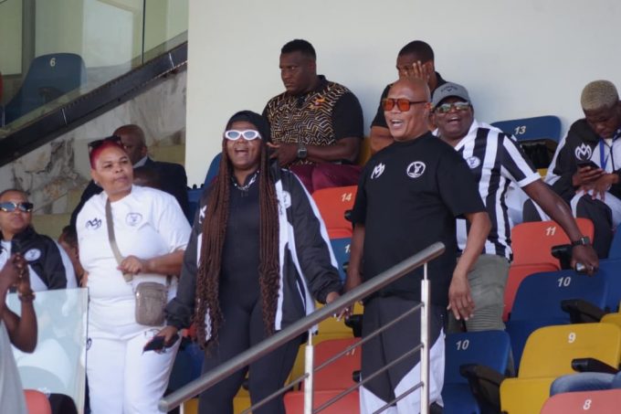 Highlanders AM boss Shauwn 'MaMkhize' Mkhize (C), General Manager (GM) Richard Makhoba (R) dance in celebration as the club cruised over Amawele.