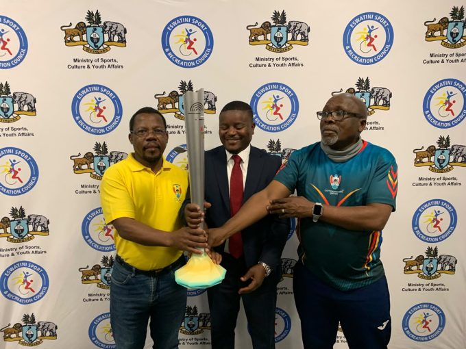 EOCGA representative Zakhele Zulu, AUSC Region 5 torch relay delegation head Arsenio Sarmento and Team Eswatini Chef de Mission Victor ‘Mavikane’ Dlamini with the torch.