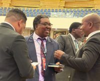 Principal Secretary Sydney Simelane (C).
